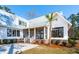 Exterior angle of the side of this home with white siding, black trim and a metal roof at 105 Peninsula Dr, Ravenel, SC 29470