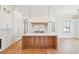 Modern kitchen featuring a large center island, marble backsplash, and stainless steel appliances at 105 Peninsula Dr, Ravenel, SC 29470