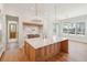 Bright kitchen featuring a marble island, stainless steel appliances, and modern pendant lighting at 105 Peninsula Dr, Ravenel, SC 29470