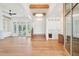 Spacious open-concept living area with hardwood floors, stairs, and a view of the kitchen at 105 Peninsula Dr, Ravenel, SC 29470