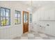 Bright mudroom features custom cabinetry, checkered tile floor, and natural light at 105 Peninsula Dr, Ravenel, SC 29470