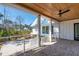 Screened porch with a brick floor and a stained wood ceiling with a ceiling fan at 105 Peninsula Dr, Ravenel, SC 29470