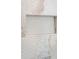 Shower niche surrounded by textured white and marble tile at 105 Peninsula Dr, Ravenel, SC 29470