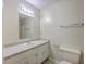 Bright bathroom features a vanity with a sink, ample storage, and a neutral color scheme at 106 Mayrant St, Summerville, SC 29483