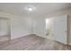 Spacious bedroom with hardwood floors and multiple entryways offering versatile space at 106 Mayrant St, Summerville, SC 29483