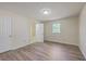 Inviting bedroom with vinyl floors, a window that allows natural light, and ample closet space for storage at 106 Mayrant St, Summerville, SC 29483