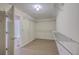 Spacious walk-in closet features wire shelving and tile floor at 106 Mayrant St, Summerville, SC 29483
