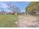 The home boasts a spacious front yard with mature trees, and a covered front porch at 106 Mayrant St, Summerville, SC 29483