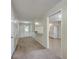 Hallway leading to the kitchen featuring a breakfast bar and neutral colors that seamlessly flow from one space to the next at 106 Mayrant St, Summerville, SC 29483