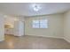 Eat-in kitchen offering tile floors, bright, white cabinets, and natural light from the adjacent window at 106 Mayrant St, Summerville, SC 29483