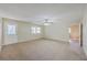 Large room with carpet, a ceiling fan, and lots of space at 106 Mayrant St, Summerville, SC 29483