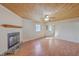Bright living room with wood-paneled ceiling, fireplace, and abundant natural light at 106 Mayrant St, Summerville, SC 29483