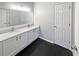 Bathroom featuring a double sink vanity and sleek black tile flooring at 107 Hainsworth Dr, North Charleston, SC 29418