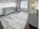 Neutral Bedroom with gray crib, chair and ottoman, and modern decor with lots of natural light at 107 Hainsworth Dr, North Charleston, SC 29418