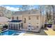 Backyard features a pool, screened in porch, deck and patio furniture perfect for outdoor living at 1104 Old Course Ln, Mount Pleasant, SC 29466
