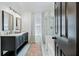 Bathroom features double sinks, marble countertops, and separate shower and tub at 1104 Old Course Ln, Mount Pleasant, SC 29466