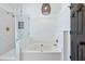 Modern bathroom boasts a soaking tub, separate shower, and stylish pendant lighting at 1104 Old Course Ln, Mount Pleasant, SC 29466