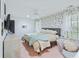 Bedroom features wallpapered accent wall, ceiling fan and lots of natural light at 1104 Old Course Ln, Mount Pleasant, SC 29466
