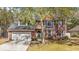 Charming two-story brick home with attached garage and lush front yard landscaping at 1104 Old Course Ln, Mount Pleasant, SC 29466