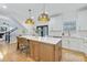Bright kitchen featuring a central island with seating, stainless steel appliances, and modern lighting at 1104 Old Course Ln, Mount Pleasant, SC 29466