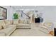 Cozy living room with a comfortable sofa, staircase, and view into the kitchen at 1104 Old Course Ln, Mount Pleasant, SC 29466