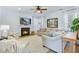 Bright living room featuring a fireplace, comfortable seating, and stylish decor at 1104 Old Course Ln, Mount Pleasant, SC 29466