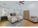 Bright main bedroom with a ceiling fan, hardwood floors and neutral decor at 1104 Old Course Ln, Mount Pleasant, SC 29466