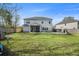 Expansive backyard with a patio, screened porch, and play area, perfect for outdoor living and recreation at 1114 Donerail Ln, Johns Island, SC 29455