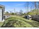 Large backyard with a playhouse and plenty of green space, perfect for activities at 1114 Donerail Ln, Johns Island, SC 29455