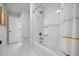 Bright bathroom featuring a tub and shower with white tile and a colorful shower curtain at 1114 Donerail Ln, Johns Island, SC 29455