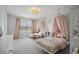 Charming ' bedroom featuring two twin beds with canopies and soft pink accents at 1114 Donerail Ln, Johns Island, SC 29455