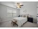 Well-lit bedroom featuring a large window with blinds and a modern ceiling fan at 1114 Donerail Ln, Johns Island, SC 29455