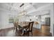 Dining area with coffered ceilings and modern chandelier at 1114 Donerail Ln, Johns Island, SC 29455