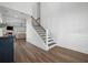 Bright foyer featuring hardwood floors, a staircase, and a view of the living space at 1114 Donerail Ln, Johns Island, SC 29455
