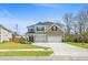 Two-story home with a two-car garage and an inviting landscaped front yard at 1114 Donerail Ln, Johns Island, SC 29455