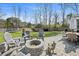 Backyard with a stone fire pit and outdoor seating area, perfect for entertaining guests at 1114 Donerail Ln, Johns Island, SC 29455