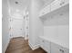 Hallway with built in storage space and wood flooring at 1114 Donerail Ln, Johns Island, SC 29455