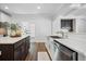 Contemporary kitchen island with white quartz countertop, stainless steel sink, and stainless steel appliances at 1114 Donerail Ln, Johns Island, SC 29455