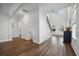Spacious living area with a staircase, a two-story ceiling and hardwood floors at 1114 Donerail Ln, Johns Island, SC 29455
