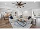 Open-concept living room featuring neutral decor and hardwood floors at 1114 Donerail Ln, Johns Island, SC 29455