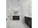 The spacious main bathroom features dual sinks, tile floors and a glass shower at 1114 Donerail Ln, Johns Island, SC 29455