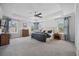 Large main bedroom with carpet flooring, tray ceiling and large windows at 1114 Donerail Ln, Johns Island, SC 29455