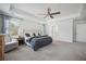 Spacious main bedroom featuring plush carpet, tray ceilings and a ceiling fan at 1114 Donerail Ln, Johns Island, SC 29455