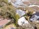 Aerial view highlighting the property's dock, home, and proximity to the marsh and surrounding landscape at 12 Trachelle Ln, Charleston, SC 29407