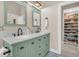 Bathroom showcasing a double vanity, walk-in closet, and a brightly lit space at 12 Trachelle Ln, Charleston, SC 29407