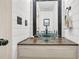 This stylish bathroom features a glass vessel sink, shiplap walls, and modern black fixtures at 12 Trachelle Ln, Charleston, SC 29407