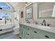 Bathroom featuring a soaking tub, large shower, double vanity with marble countertop, and blue-gray flooring at 12 Trachelle Ln, Charleston, SC 29407