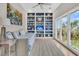 Bedroom with built-in shelving, daybed, and a large window offering natural light and scenic views at 12 Trachelle Ln, Charleston, SC 29407