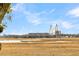 Scenic view showcasing a suspension bridge rising above golden marshlands against a bright, partly cloudy sky at 12 Trachelle Ln, Charleston, SC 29407