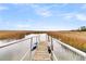 Scenic dock with a kayak, perfect for enjoying waterfront living and outdoor activities at 12 Trachelle Ln, Charleston, SC 29407